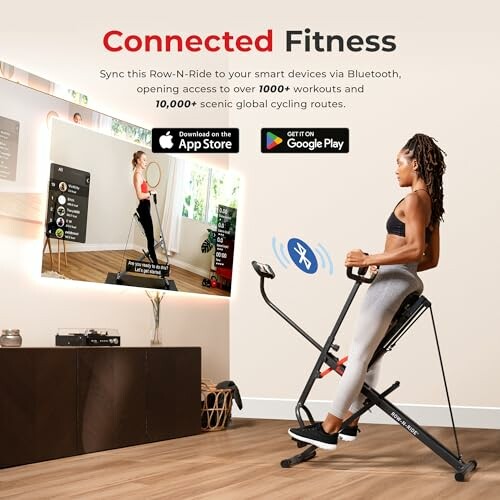 Woman using fitness bike with TV showing workout app.